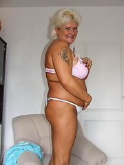 Aged white-haired mom demonstrating her busty naked body